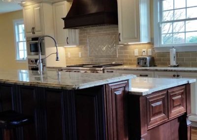 Kitchen island with wooden design by Mountaineer Kitchens and Baths