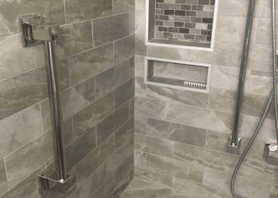 Shower shelf and handle by Mountaineer Kitchens & Baths