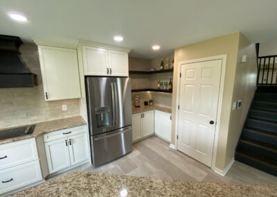 White kitchen cabinets with stainless steel appliances by Mountaineer Kitchens and Baths