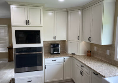 Eggshell white kitchen cabinets installed by Mountaineer Kitchens and Baths