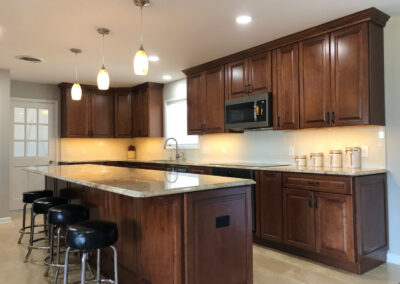 Dark wood kitchen cabinets installed by Mountaineer Kitchens and Baths