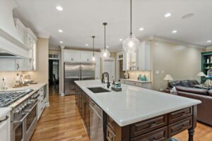 white kitchen island and steel kitchen appliances in Harper's Ferry