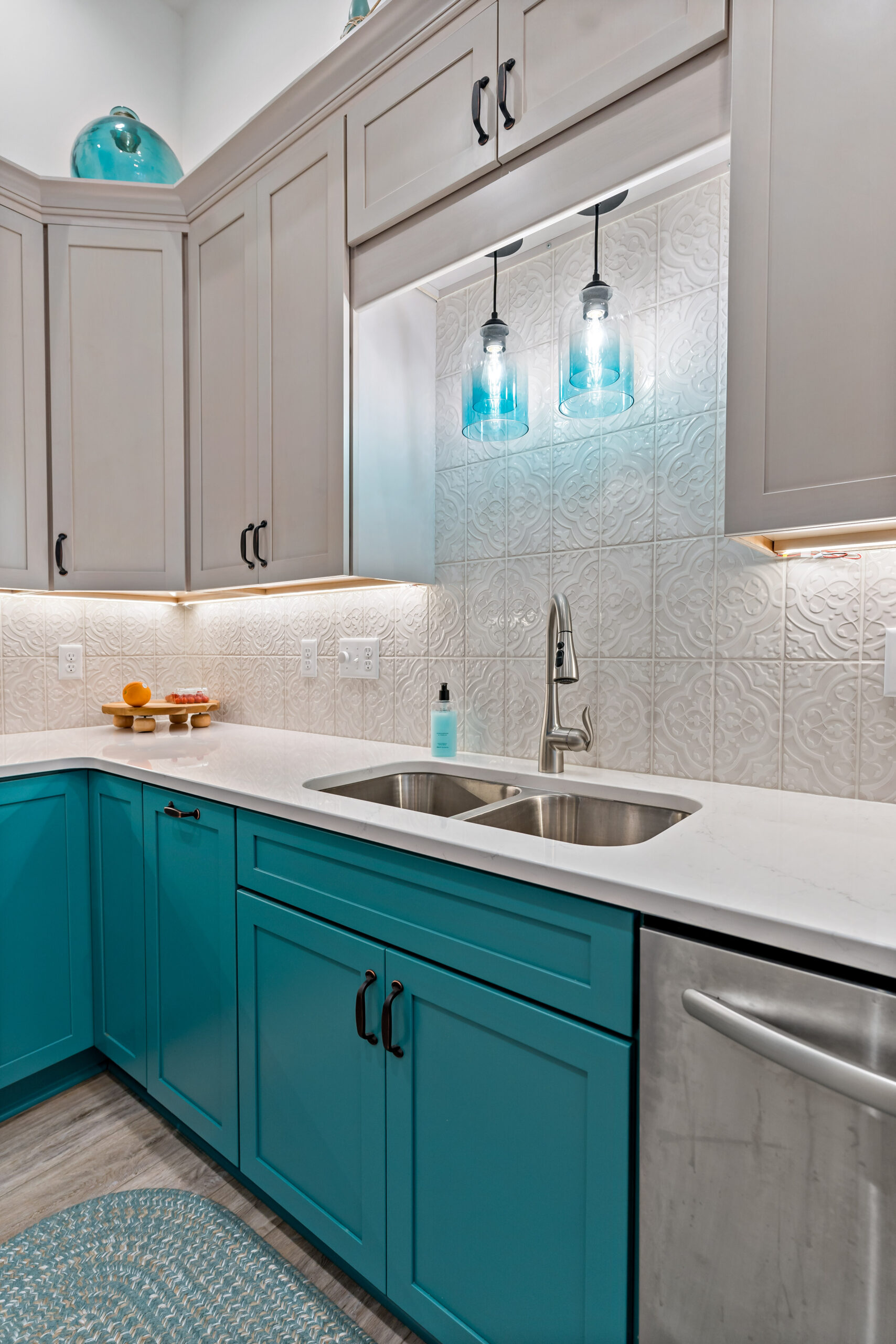 kitchen sink and blue kitchen cabinets