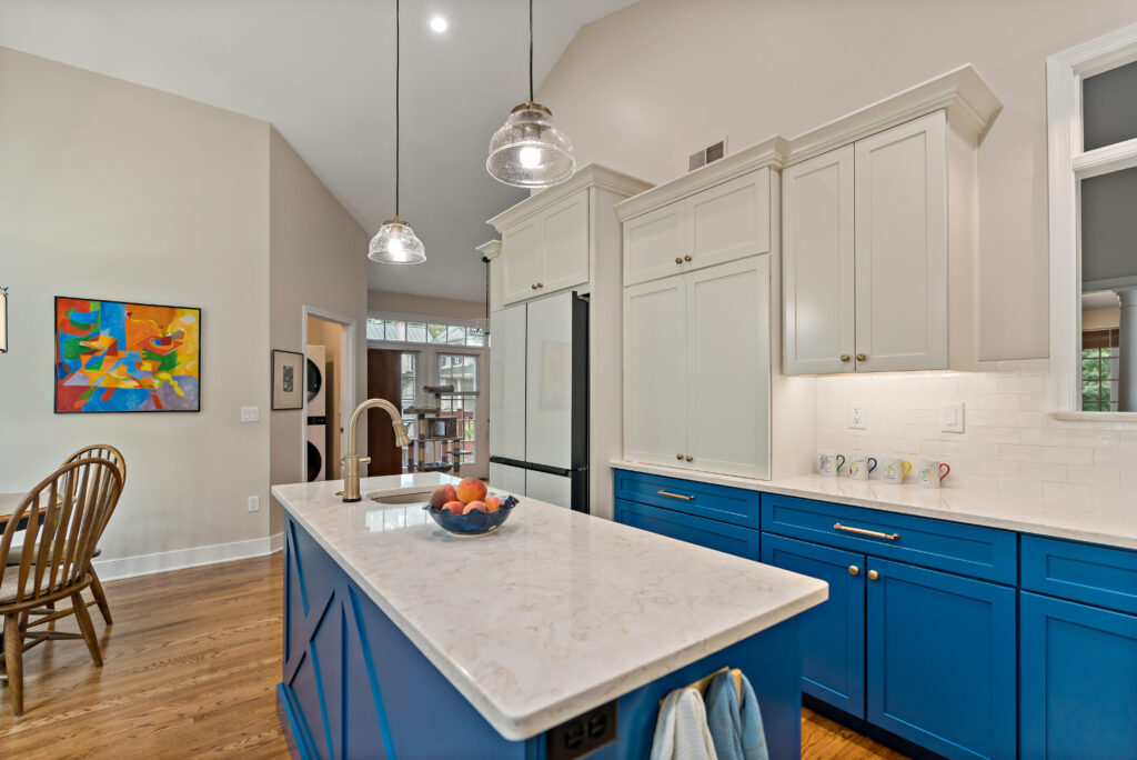 blue kitchen cabinets and quartz island