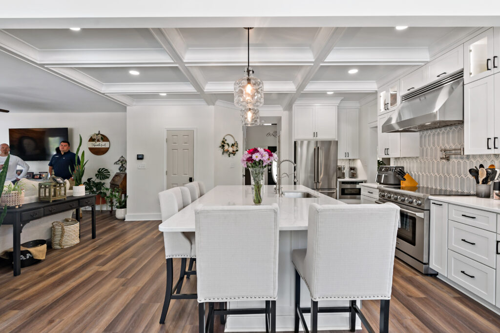 white kitchen island with hardwood floors