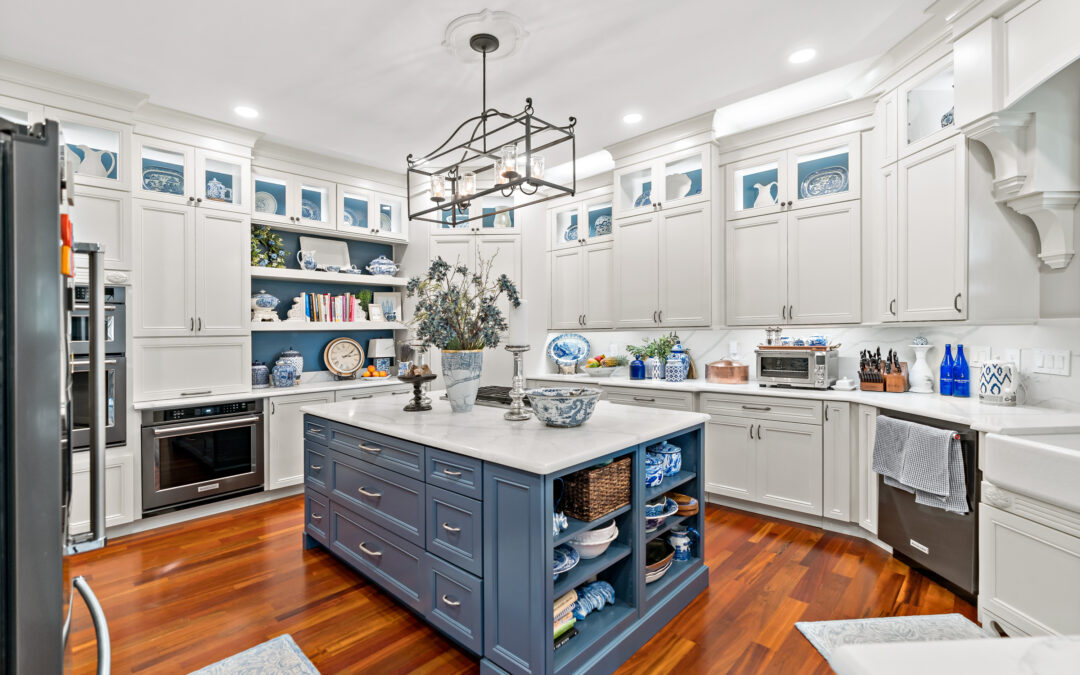 blue kitchen island with hardwood floors