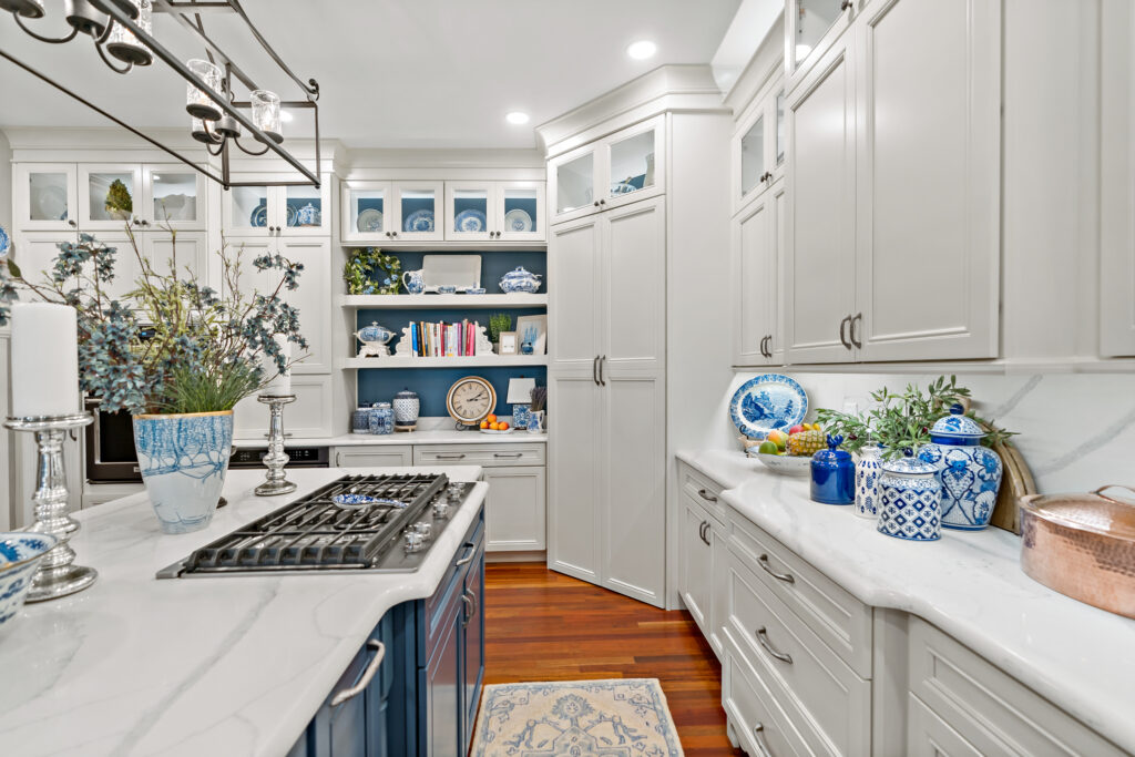 kitchen island with custom cabinets and hardwood floors