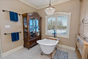 soaking tub and bathroom shelving