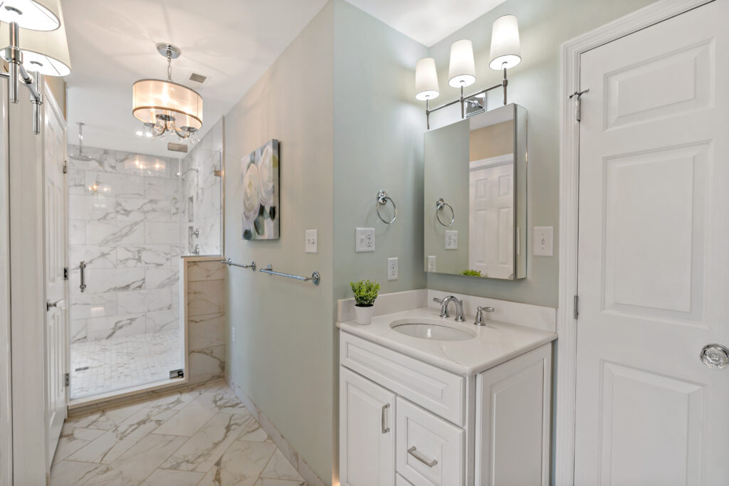 white bathroom cabinets and walk in shower